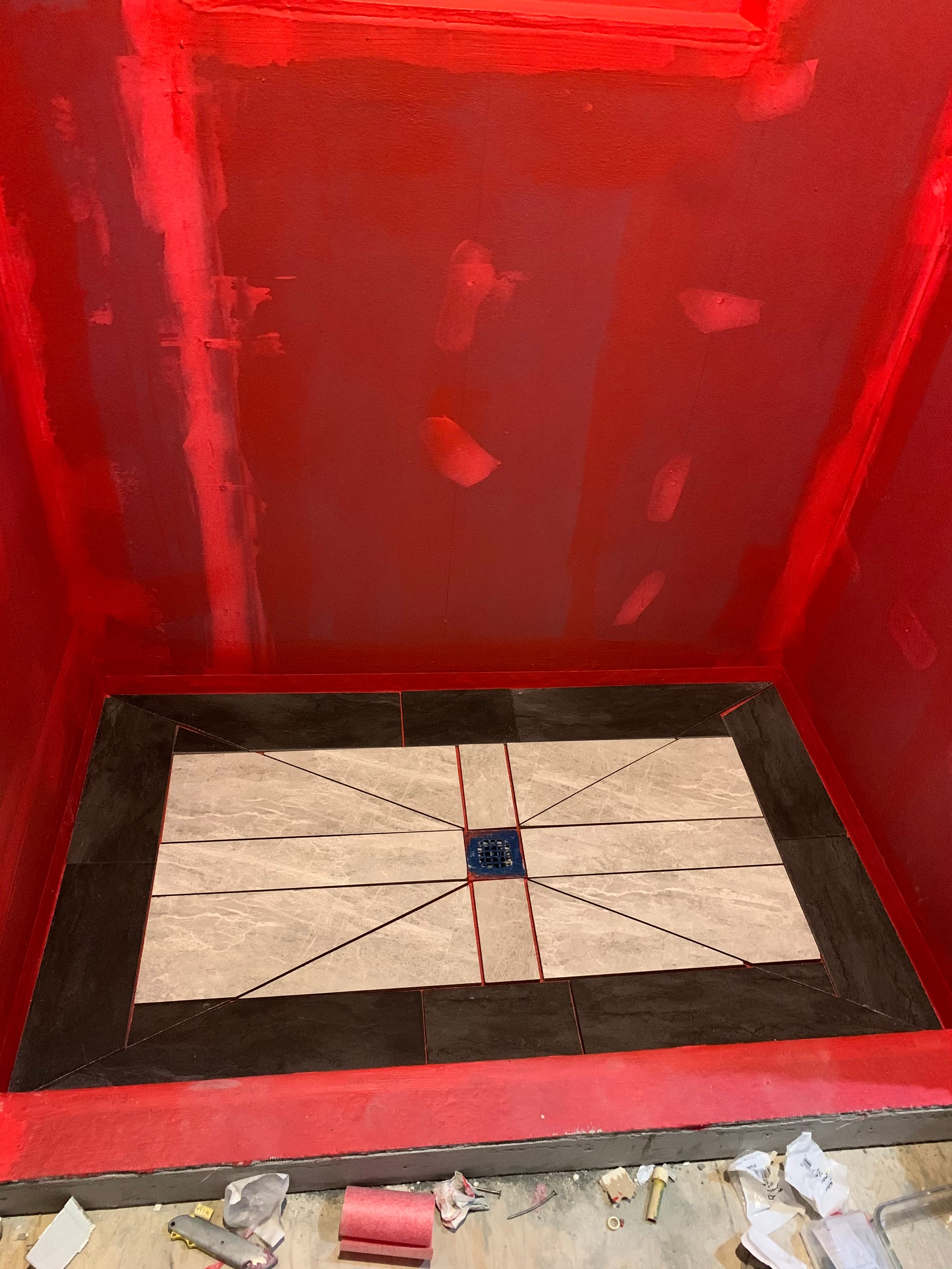 Custom shower floor tile installation with pattern in Maryland by Atlantic Construction