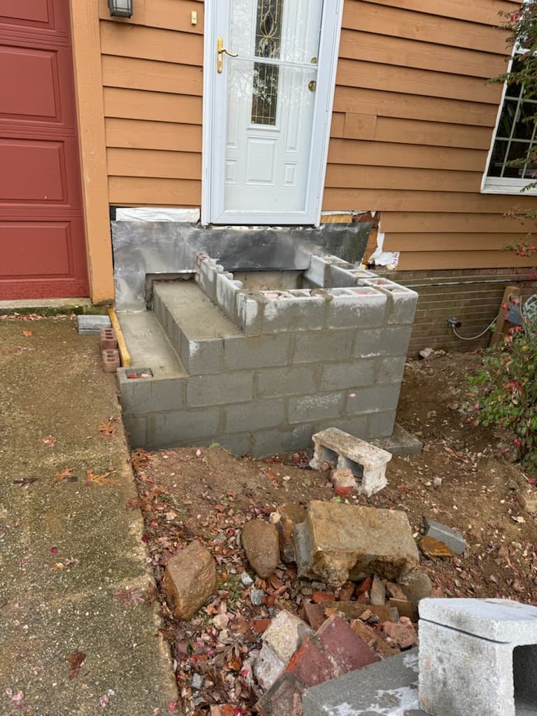 Front entry porch masonry rebuild in progress in Maryland by Atlantic Construction