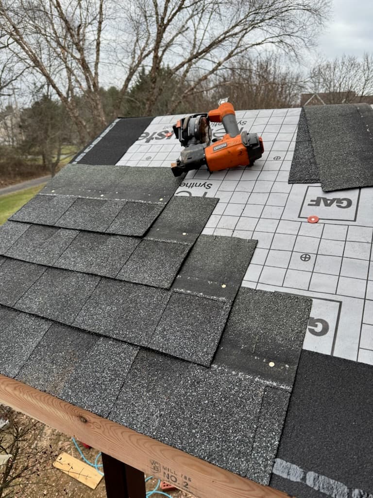 Residential asphalt shingle roofing installation in progress in Maryland by Atlantic Construction
