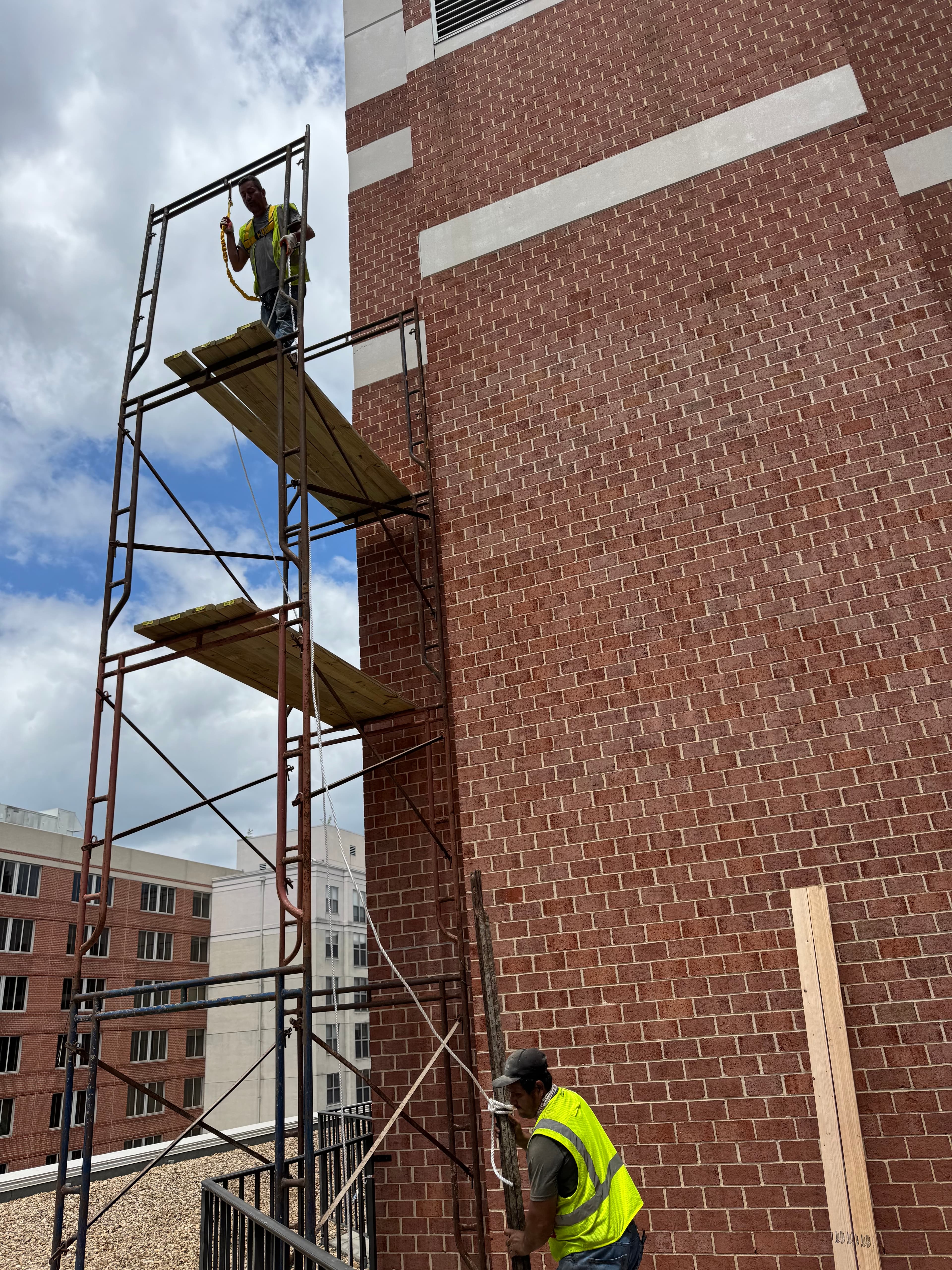 Commercial brick exterior masonry work with scaffolding in DC by Atlantic Construction
