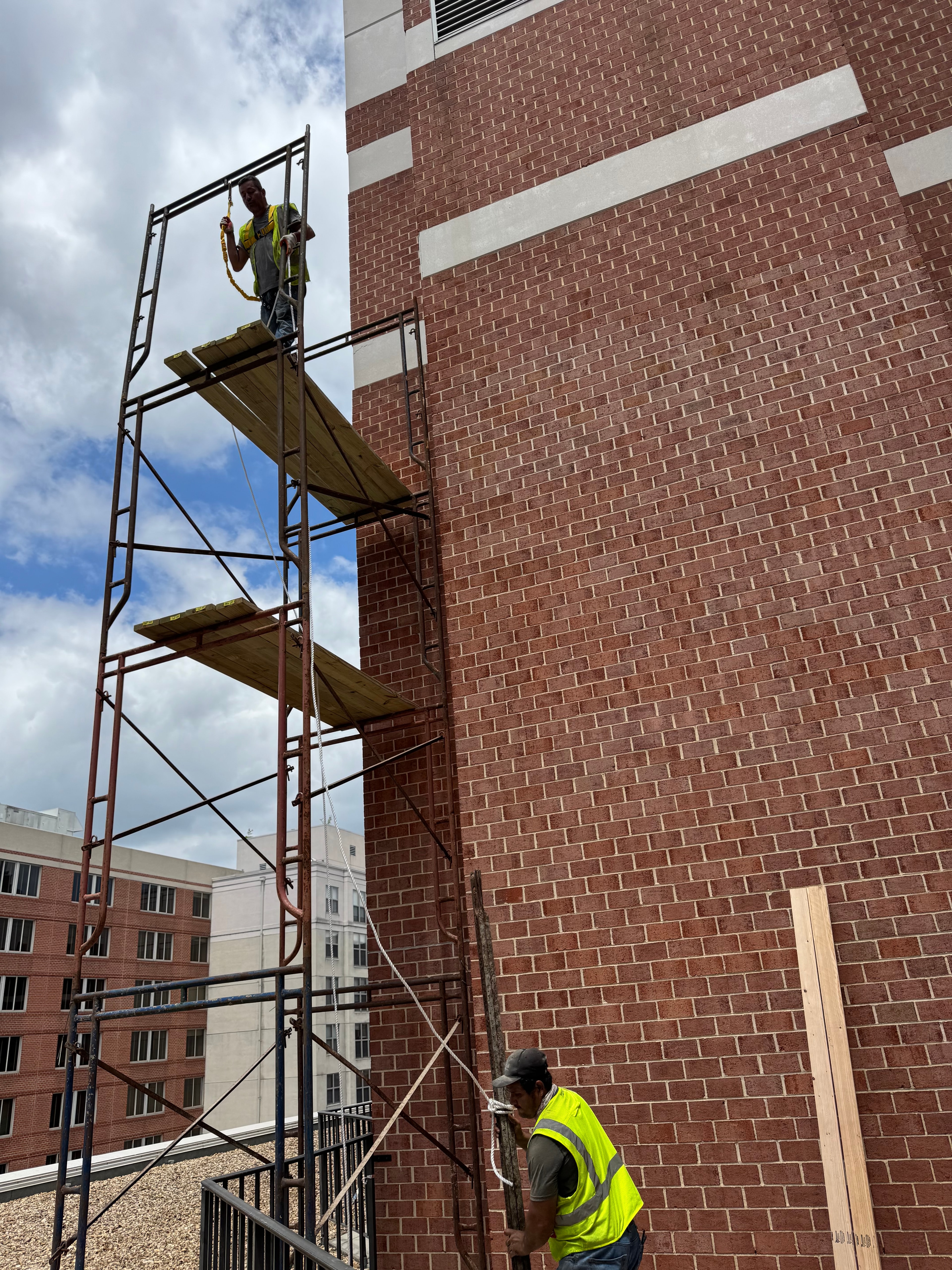 Commercial brick exterior masonry work with scaffolding in DC by Atlantic Construction